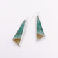 Triangular earrings with a green and brown design on a white background